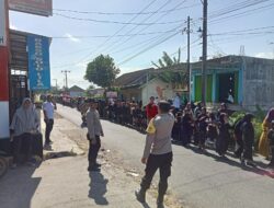 Sinergi TNI-Polri dan BKD Amankan Gerak Jalan HUT RI ke-80 di Desa Jelantik ‎