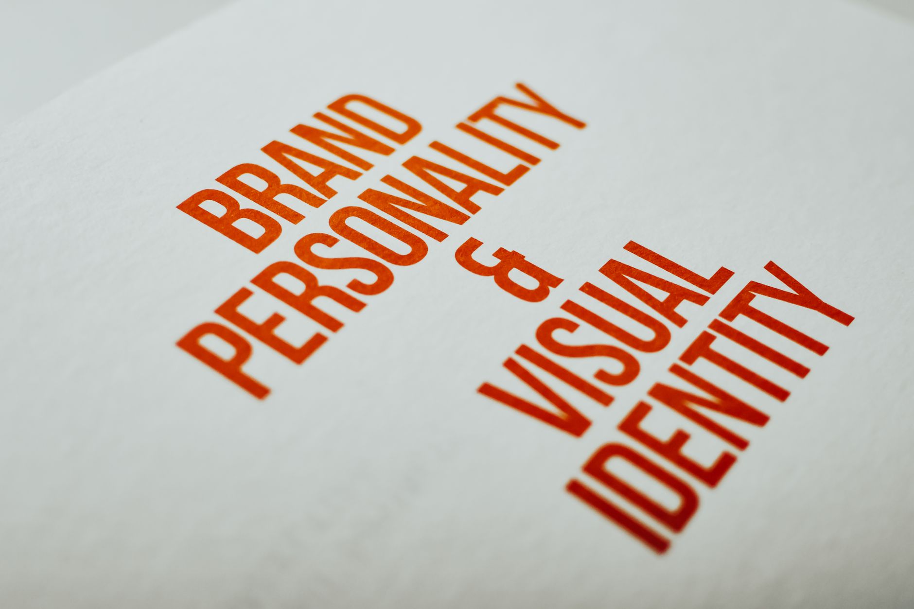 Text on white background reads Brand Personality & Visual Identity in red.